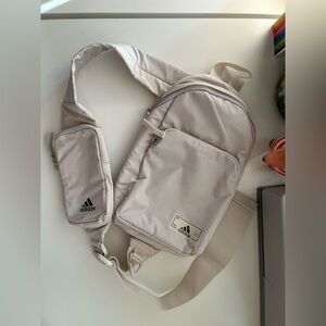 Off-white Adidas sling with lots of pockets